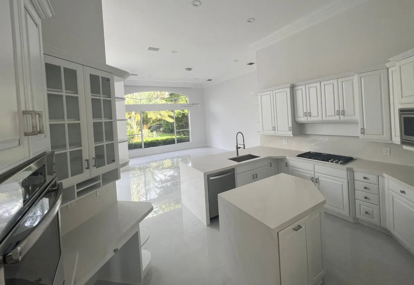 White kitchen cabinetry with coordinated cabinet finishes
